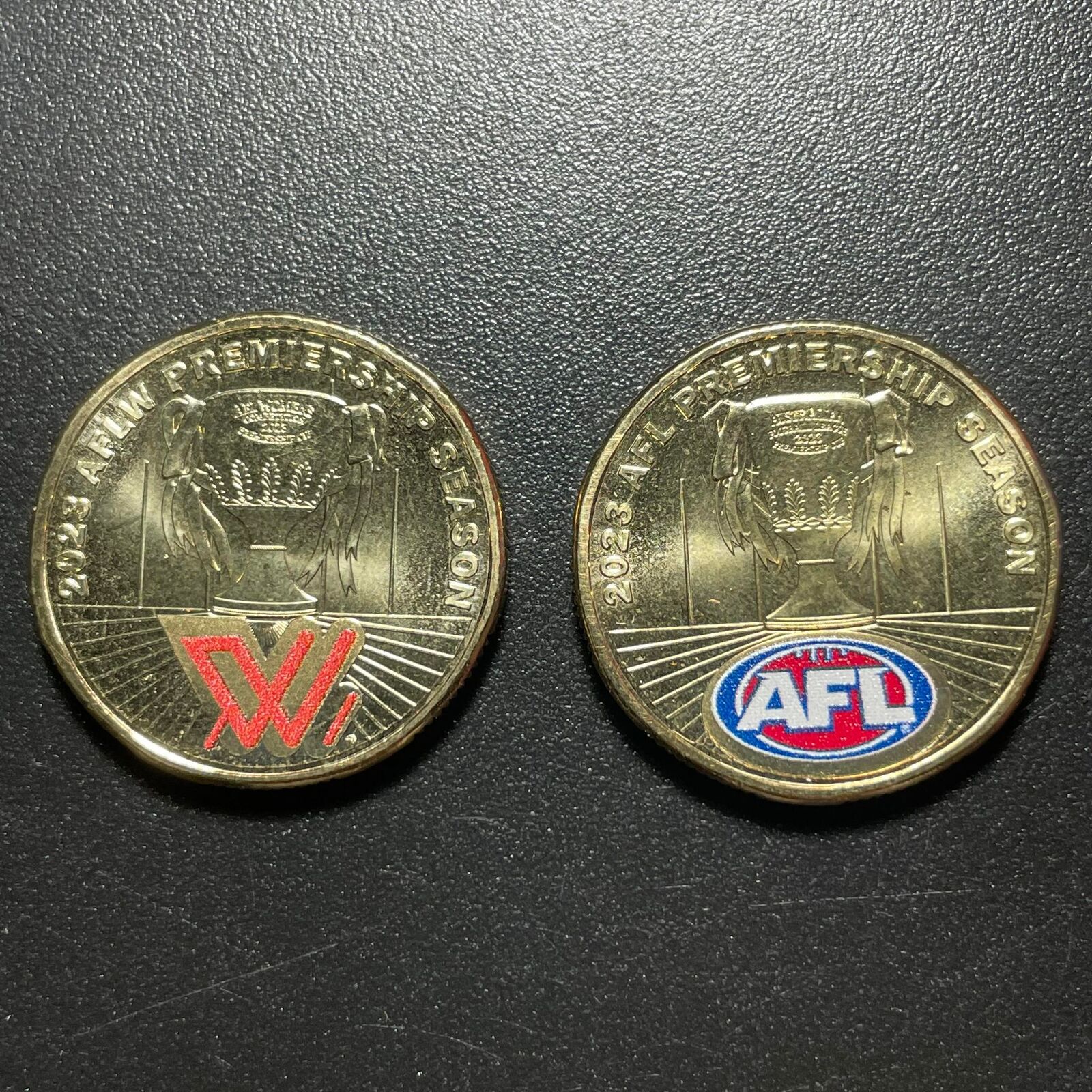 2 x AFL $1 Coloured Coins + 2023 $1 AFL 20 Coin Collection: 18 x Teams $1 Uncirculated Set In Pop In Folder